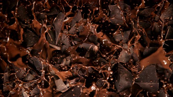 Super Slow Motion Shot of Melted Chocolate Explosion Through Chocolate Chunks at 1000 Fps