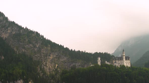 Neuschwanstein Castle in misty day, Bavaria in Germany. Zoom in