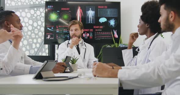 Men and Women Discussing Different Versions of Treatment After Watching Results of Patient's X-ray