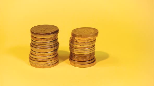 Hand Stacking Different Coins