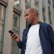 African American Man Using Business App on Smart Phone - VideoHive Item for Sale