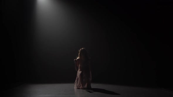 Motion of a Lovely Girl Practicing Contemp in Dark Studio.