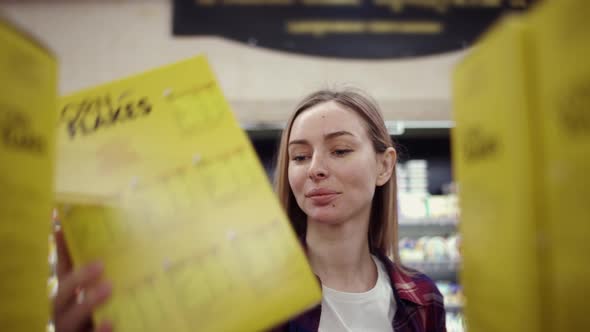 Footage From the Shelf  Blonde Woman Picking Corn Flakes From the Shelf