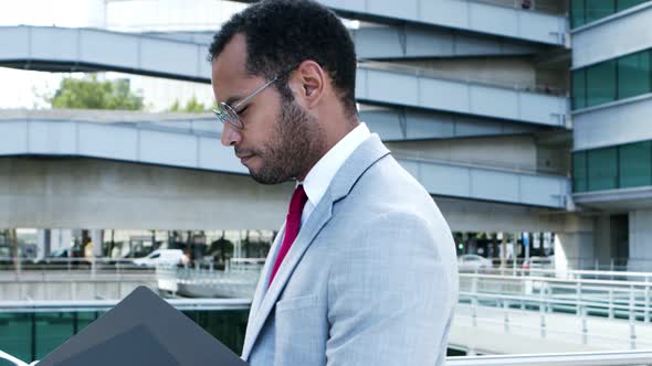 Professional Businessman Looking at Folder