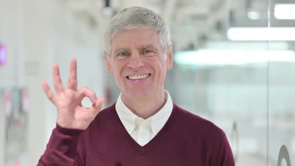 Middle Aged Man Showing Ok Sign By Hand 