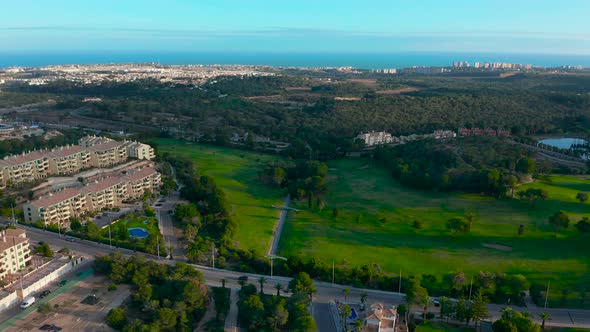 Aerial View. Empty Golf Course. Breathtaking Sunset Shining on Golf Course.