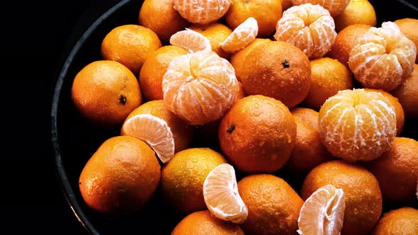 Juicy and Ripe Tangerines on a Dark Background