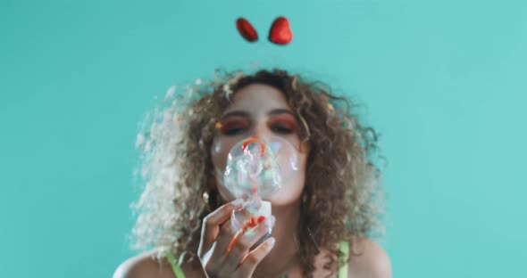 Girl blowing bubbles