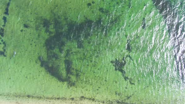 Top View Of Bright Blue Ocean Water Glistening In Sunlight Near Edgartown Harbor In Massachusetts. a