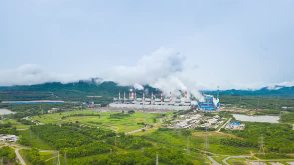 Aerial view over coal-fired power plant at sun dawn.