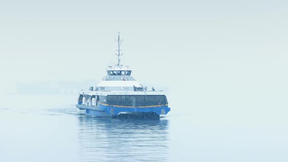 Ferry Approaching In Heavy Snowfall