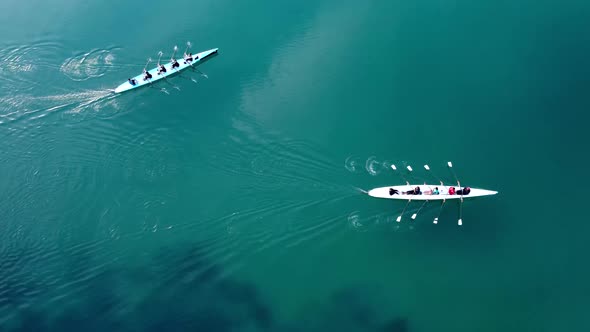 Aerial Drone Bird's Eye View Video of Two Sport Canoe Operated By Team of Young Men and Women