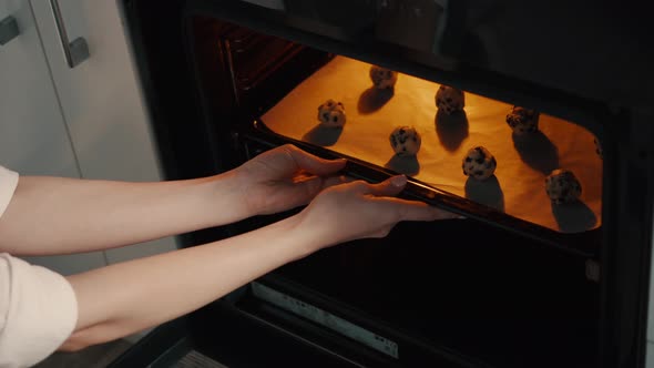 Young Housewife Making Homemade Cookies in Kitchen