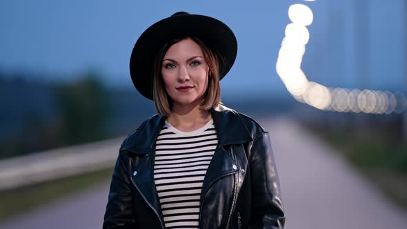 Portrait of Young Pretty Woman Standing on Empty Night Street with Lanterns