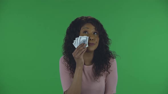 Portrait of Beautiful African American Young Woman Is Looking at Camera and Cries with Happiness and