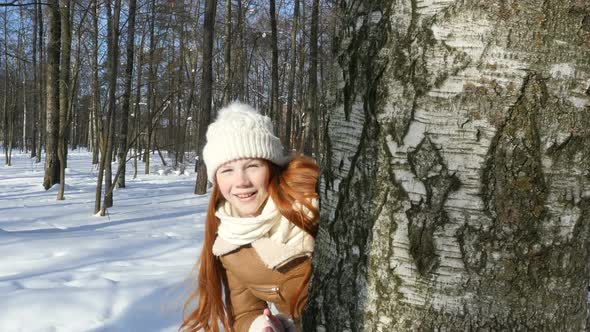 Happy Teenager Girl Playing In Winter Park, Kid Lets The Sunlight Spot