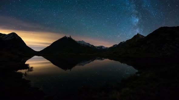 Night Sky on The Alps, Time Lapse Milky Way Stars Rotating Over Mountains