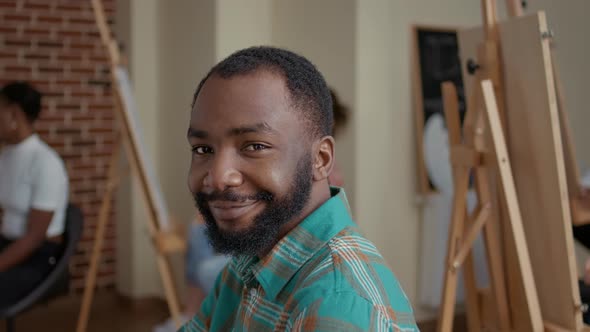 Portrait of Young Student Smiling and Learning to Draw Sketch