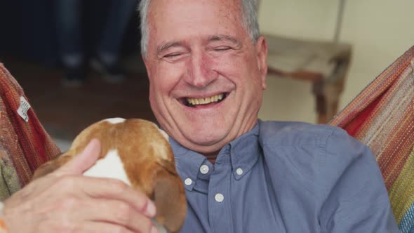 Senior man and his dog at home