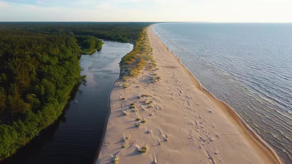 Irbe River Meets Baltic Sea in Latvia Aerial Dron 4K Shot.