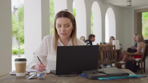 Beautiful Businesswoman Discussing with Team Job Project Video Conference Call