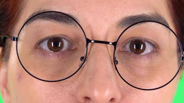 Surprised Female Eyes in Round Glasses, Close Up