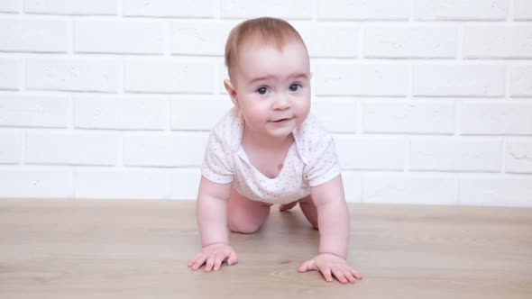 Baby crawling for the first time at home.