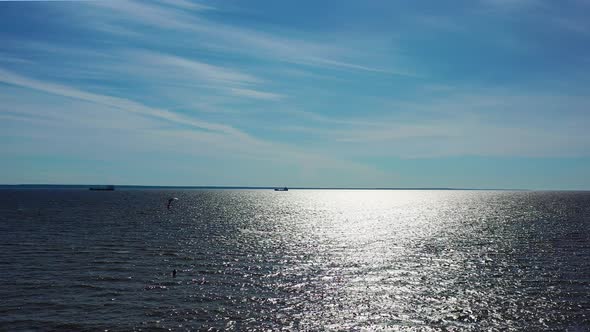 people kite surfing ride on the waves in the Baltic Sea