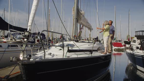 Senior couple on sailboat together. Shot on RED EPIC for high quality 4K, UHD, Ultra HD resolution.