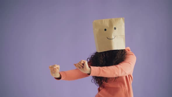 Girl with Paper Bag on Head Dancing Showing Thumbs-up Showing Like Sign