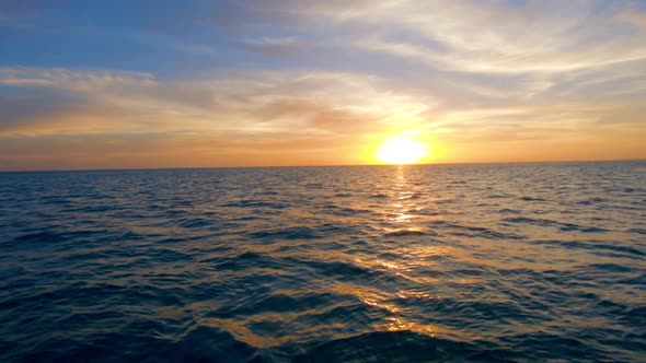 sunset over the pacific ocean in french polynesia