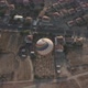 Large Hot Air Balloon Flies Over Brown Roof Buildings - VideoHive Item for Sale