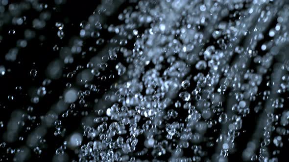 Super Slow Motion Shot of Water Shower at 1000Fps Isolated on Black Background.