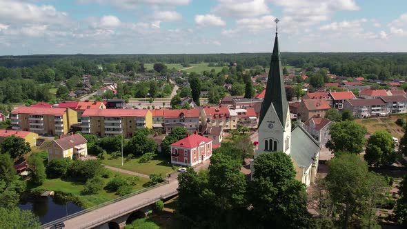 Drone circling church in idyllic village in Sweden, Högsby