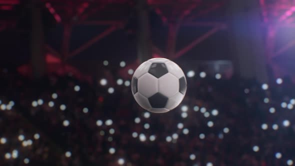 Soccer ball flying through the air in slow motion