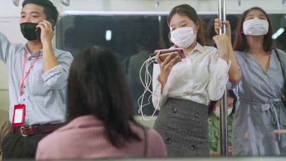 Crowd of People Wearing Face Mask on a Crowded Public Subway Train Travel