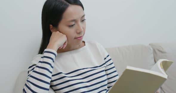 Woman Read Book and Sit on Sofa