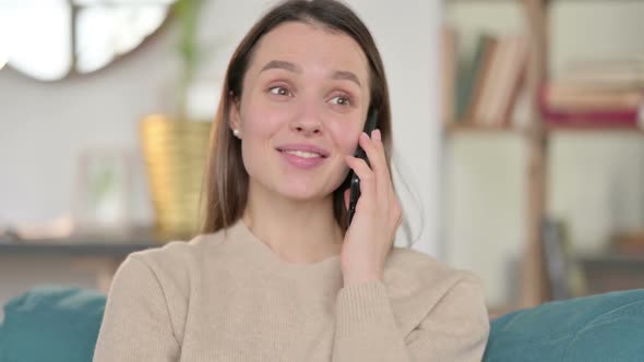 Young Woman Talking on Smartphone