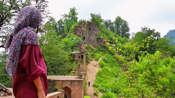 Iranian Woman Stand By Rudkhan Castle In Iran