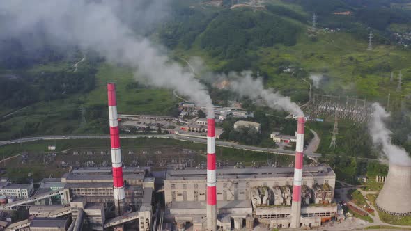 Aerial View of the Pipes of a Coal Power Plant and Cooling Tower