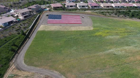 American Flag Stock Video Footage - A Grass Field Landscaped With A Large American Flag