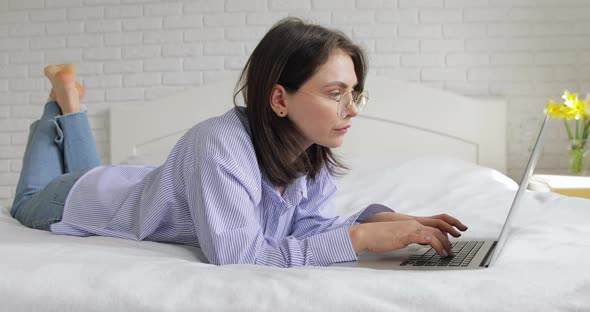 Stylish brunette working from home office. 