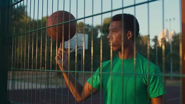 Skillful Athlete Spinning Basketball on Finger