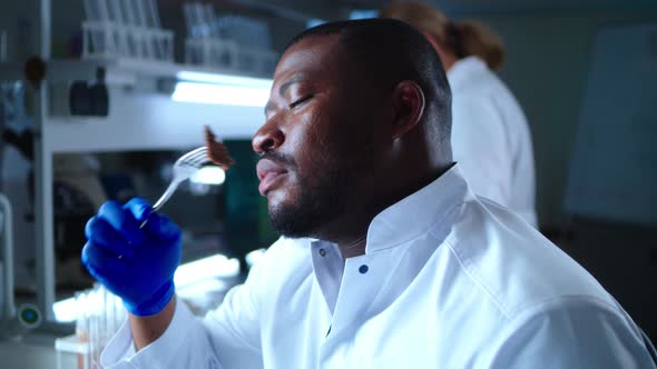 Black Scientist Eating Cell Based Meat