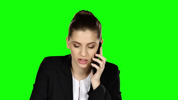 Happy Businesswoman Speaking at the Phone. Green Screen