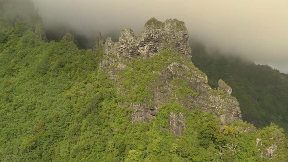Aerial shot of a rock formation on the mountain peak in Mo'orea island, a high island in French Poly