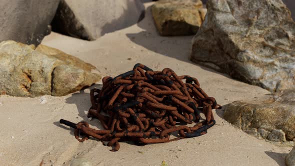 Old Rusted Chain in the Sand