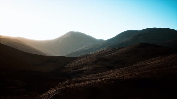 Hills with Rocks at Sunset