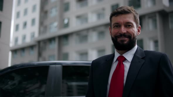 Portrait Happy Senior Businessman in an Expensive Suit in a in a Stylish a Handsome Bearded Senior