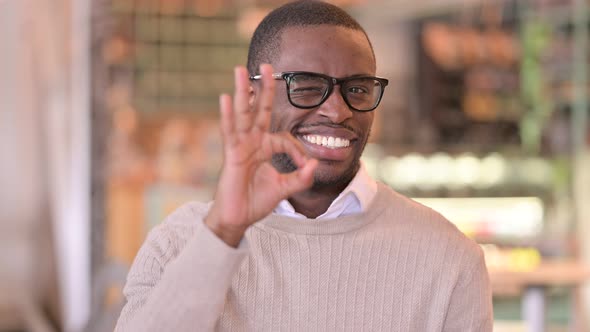 Portrait of Young African Man Showing Ok Sign 